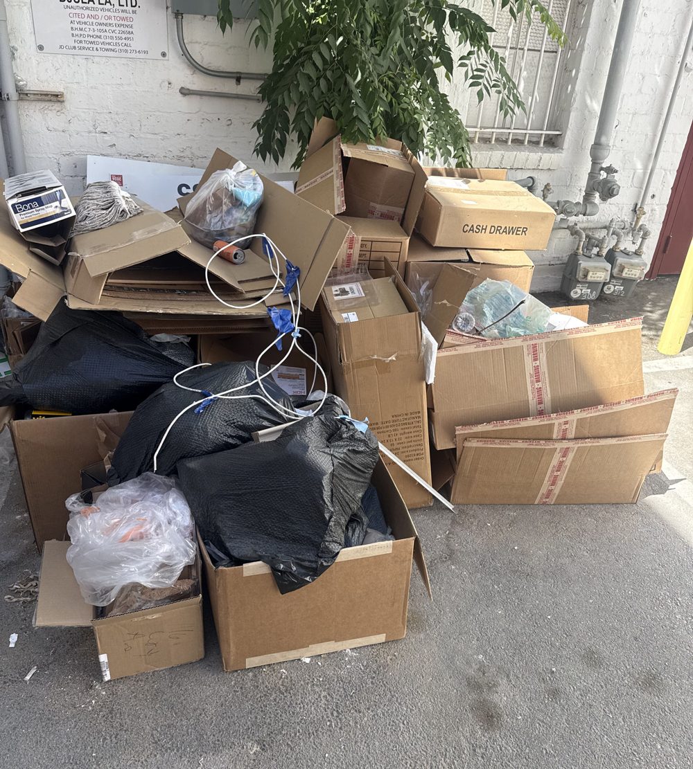 Patio crowded with boxes and bags before a cleanout