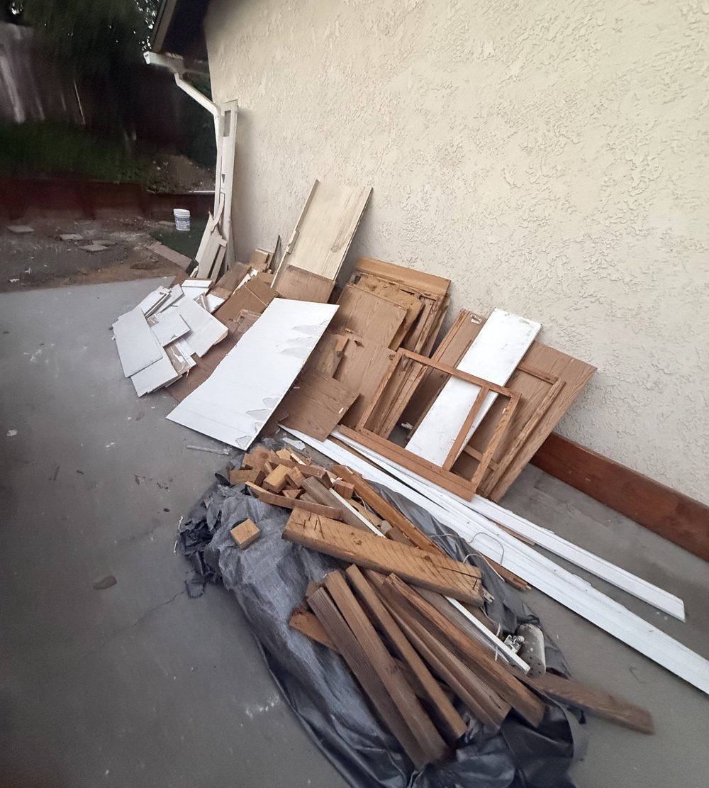 Old lumber and panels left after a small demolition job